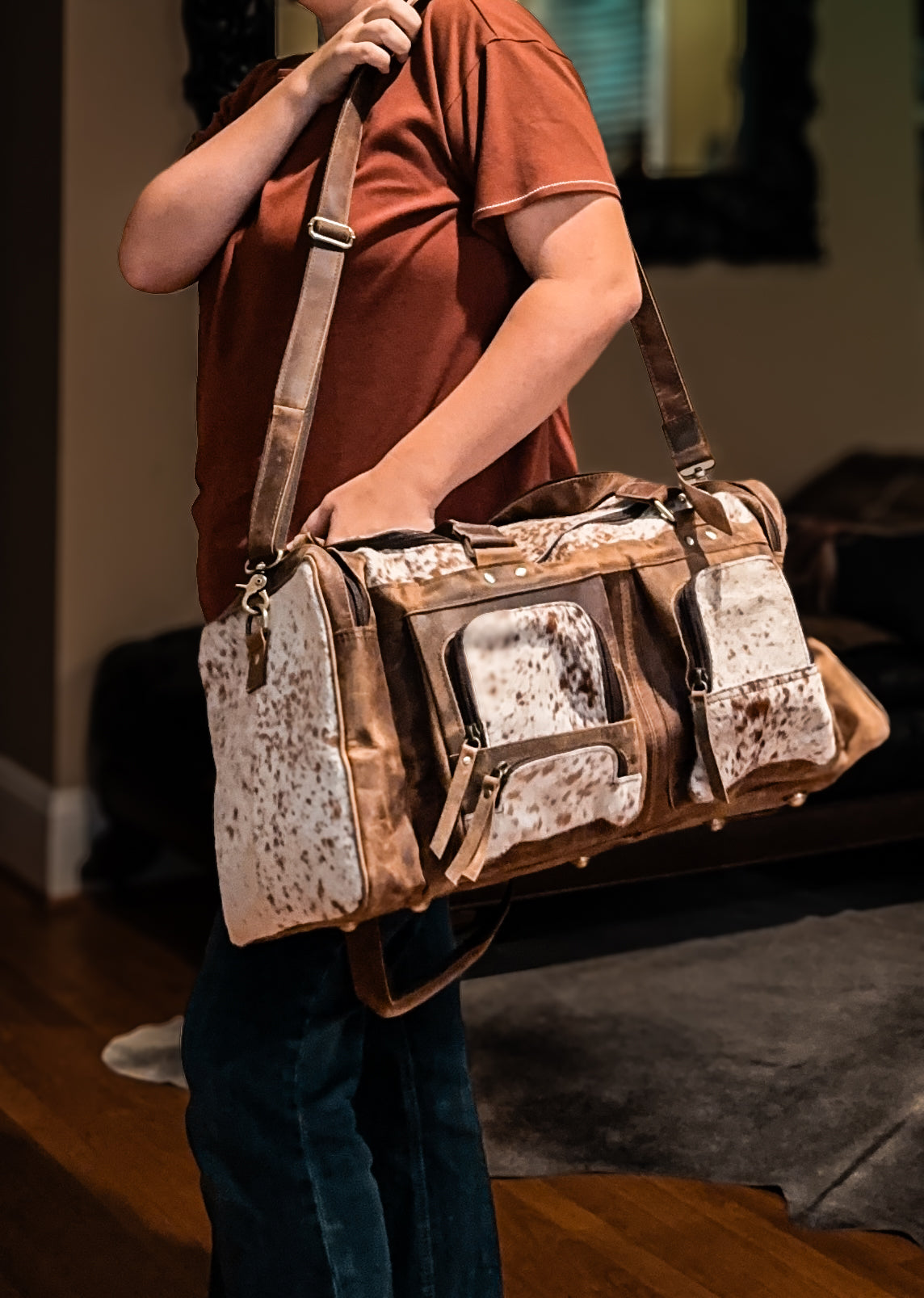 Cowhide & tan leather duffle bag