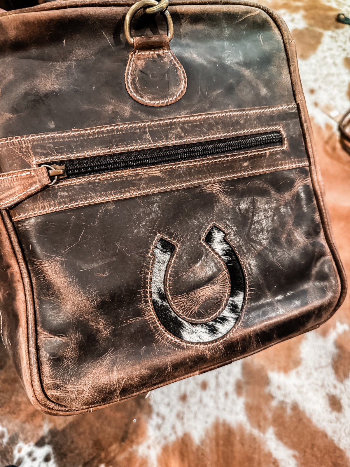 Cactus, cow tag, & horseshoe cowhide and leather duffel bag