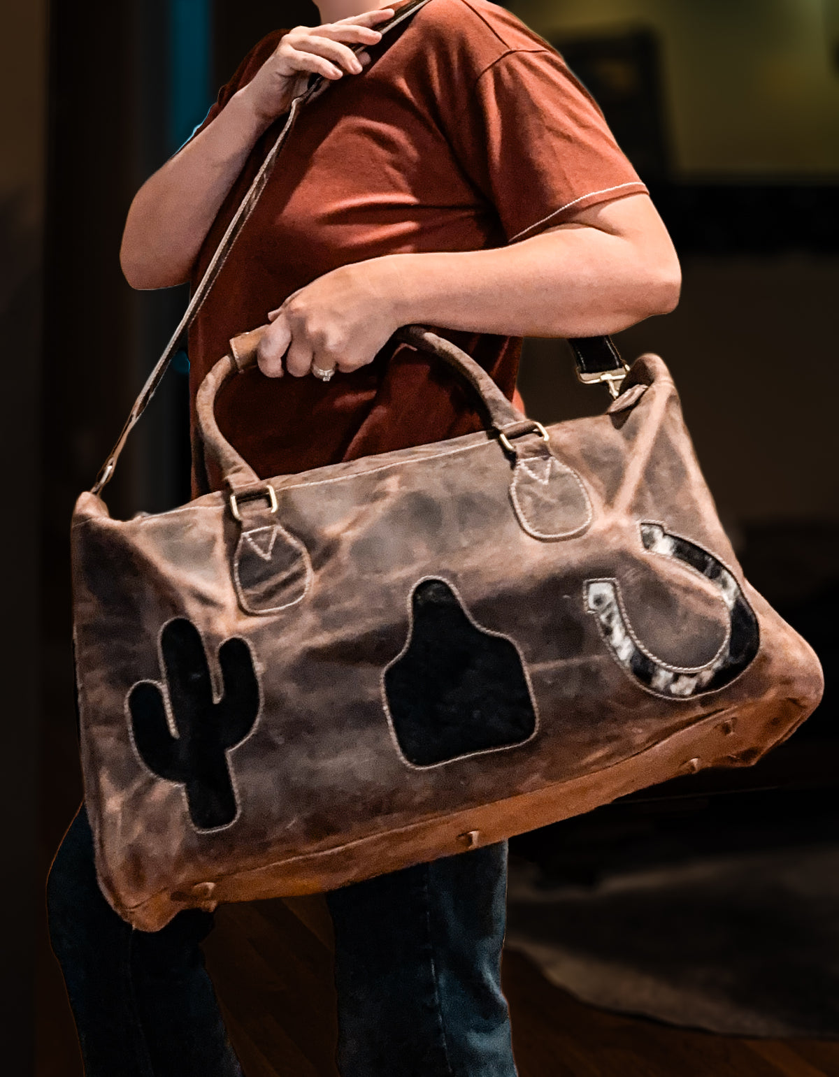 Cactus, cow tag, & horseshoe cowhide and leather duffel bag